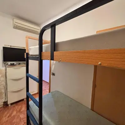 a couple of bunk beds in a room at FlexCo City - Barcelona Flats in Barcelona
