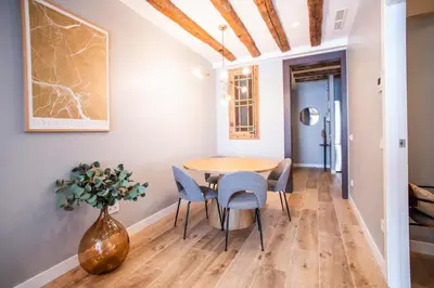a dining room with a table and chairs and a vase at E2MAL1052 - Fantastic apartment next to Sagrada Fa in Barcelona