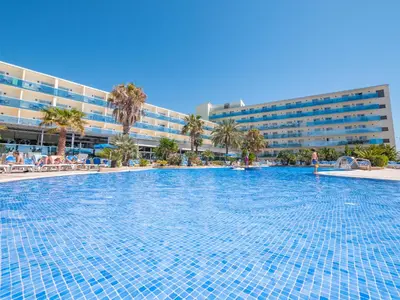 a large swimming pool in front of a hotel at Golden Taurus Aquapark Resort in Pineda de Mar