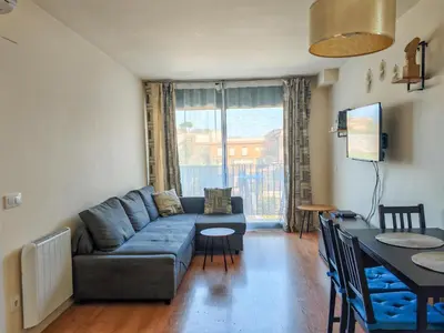 a living room with a couch and a table at Modern Apartment near the sea in Pineda de Mar