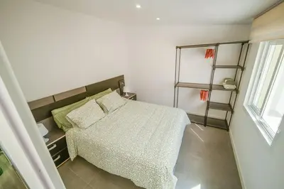 a small bedroom with a bed and a window at Cal Rami in Castellbell i Vilar