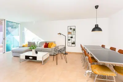 a patio with chairs and a table and a cactus at Villa Senita with Private Pool, close to Sitges in Olivella