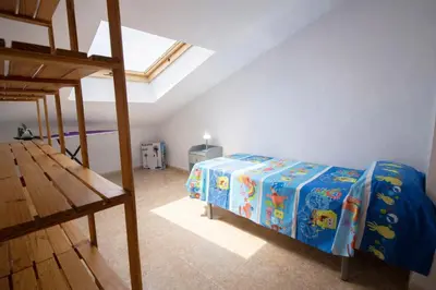 a bedroom with a bed and a bunk bed at Nature & Tranquility only 25km from Barcelona in Torrelles de Llobregat