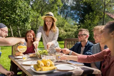 a group of people sitting around a table eating food at Nature & Tranquility only 25km from Barcelona in Torrelles de Llobregat