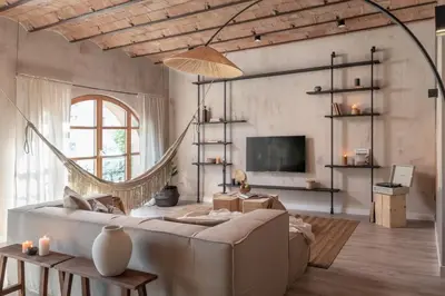 a bedroom with a bed and a desk and a window at Komodo - 3 bedrooms and terrace in El Born in Barcelona