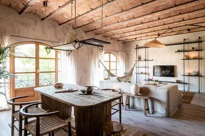 a living room with a large bed and a television at Komodo - 3 bedrooms and terrace in El Born in Barcelona