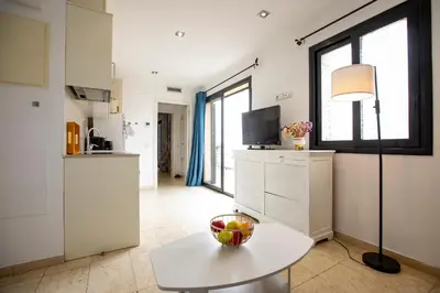 a window with a view of a building at Sunset Penthouse in Sitges