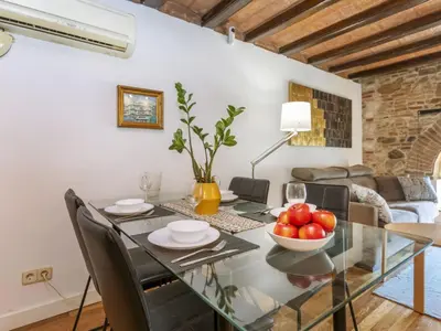 a dining room with a glass table with a bowl of fruit at Apartment Icaria by Interhome in Barcelona
