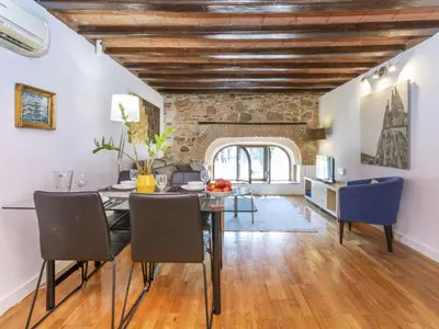 a dining room with a table and blue chairs at Apartment Icaria by Interhome in Barcelona