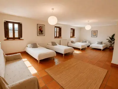 a living room with two couches and a couch at Masia Can Cenç in Collsuspina