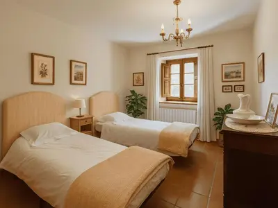 a hotel room with two beds and a window at Masia Can Cenç in Collsuspina