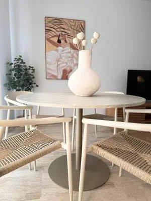 a white vase sitting on a table in a room at Boutique Temporada VG Barcelona Sant Gervasi in Barcelona
