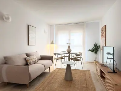 a living room with a couch and a table at Boutique Temporada VG Barcelona Sant Gervasi in Barcelona