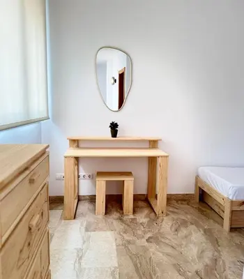 a bedroom with a dressing table and a mirror at Boutique Temporada VG Barcelona Sant Gervasi in Barcelona