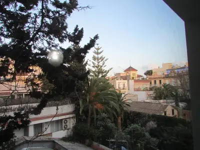 a view of a city with trees and buildings at Acogedor apartamento en el centro de Sitges in Sitges