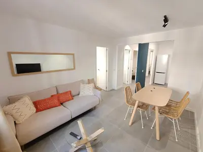 a living room with a couch and a table at Charming apartment Poblenou beach in Barcelona