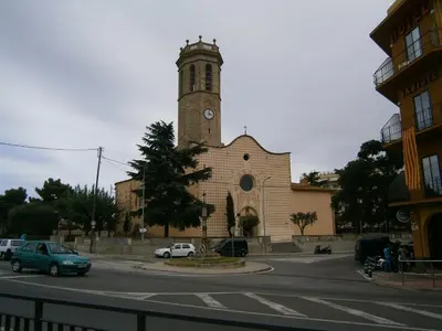 a kitchen with white cabinets and a microwave at Apartament in Pineda in Pineda de Mar