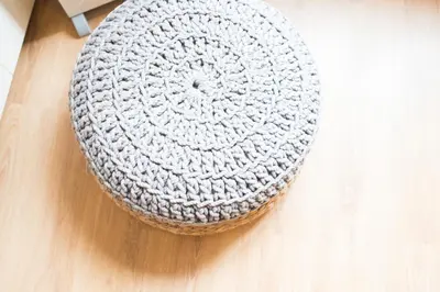 a crocheted hat sitting on a wooden table at Central apartment in Sant Antoni in Barcelona