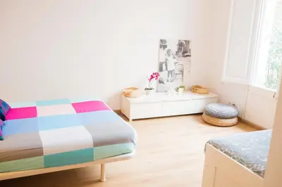 a bedroom with a bed and a window at Central apartment in Sant Antoni in Barcelona