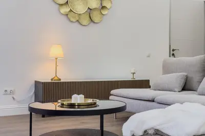 a living room with a couch and a table at Precioso apartamento en Rambla Cataluña 35 in Barcelona