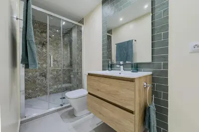 a bathroom with a toilet and a shower and a sink at Precioso apartamento en Rambla Cataluña 35 in Barcelona