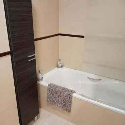 a bathroom with a bath tub and a sink at Apartamento Castellet1 in San Vicente de Castellet