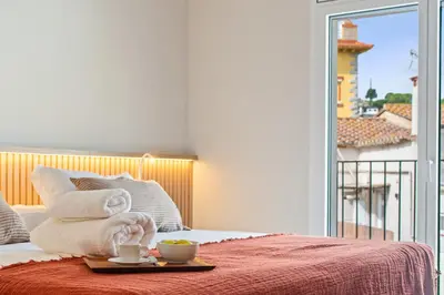 a hotel room with a bed with a tray of food at L'Hostalet de Cabrils in Cabrils