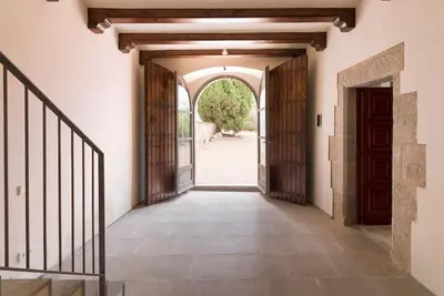 an entrance to a building with an open door at Beautiful 15th century villa on 30 acre estate, for families only in Alella