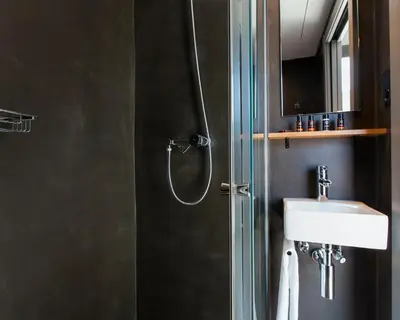a bathroom with a shower and a sink at Kare No Apartments by Sitges Group in Sitges