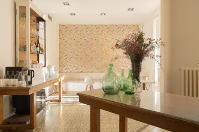a living room with a table with vases on it at Forget Me Not Barcelona in Barcelona