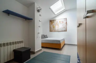 a small bedroom with a bed and a window at Bellavista in Argentona