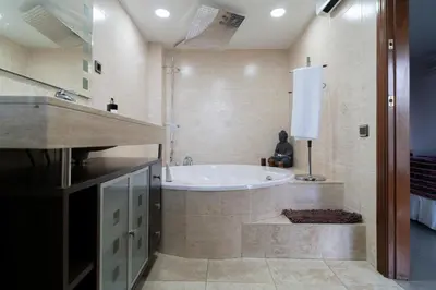 a large bathroom with a tub and a sink at Bellavista in Argentona