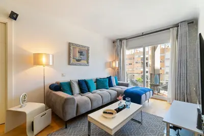 a living room with a couch and a large window at Mediterranean Soul Experience in Montgat