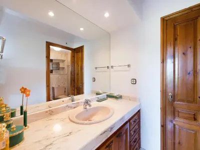 a bathroom with a sink and a mirror at Cal Tomas in Castellet