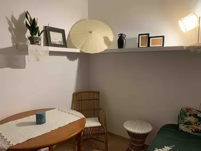 a room with a table and chairs and a mirror at CAN FENICIA - 30 min to F1 & MotoGP - Intimate Villa, Private Pool & Sea View in Arenys de Munt