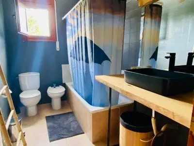 a bathroom with a sink and a toilet at CAN FENICIA - 30 min to F1 & MotoGP - Intimate Villa, Private Pool & Sea View in Arenys de Munt