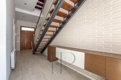 a staircase in a house with a brick wall at Gavamar in Gavà