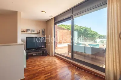 a living room with a large sliding glass door at La Pineda in Castelldefels