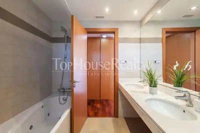 a bathroom with two sinks and a shower at La Pineda in Castelldefels