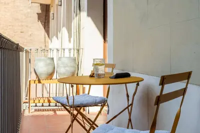 a store on the side of a building on a street at Canela Homes MIDTERM ELEGANCE in Barcelona