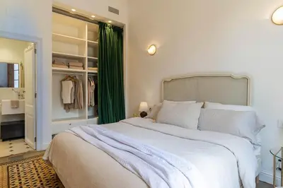 a desk with a laptop and a lamp on it at Canela Homes MIDTERM ELEGANCE in Barcelona