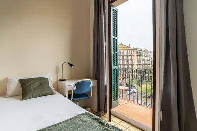 a bedroom with a bed and a view of a city at Canela Homes MIDTERM MONUMENTAL in Barcelona