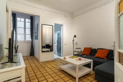 a bedroom with a large white bed with a window at Canela Homes MIDTERM MONUMENTAL in Barcelona
