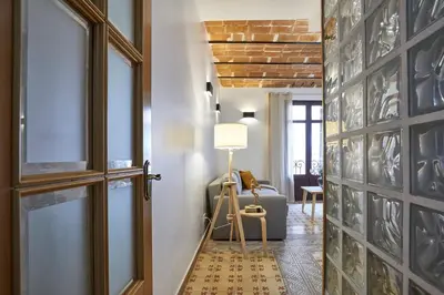 a hallway with a door leading to a living room at BBarcelona Perill Flat in Barcelona