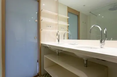a bathroom with two sinks and a mirror at Elegant and cozy retreat in Barcelona