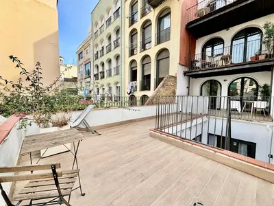 a balcony with two benches on a building at Piso con dos habitaciones con camas dobles y terrazas en el Poblenou in Barcelona