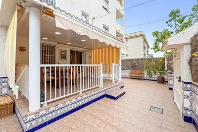 a patio of a house with a balcony at Hauzify I Casa Ribera in Cunit