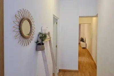 a mirror on a wall next to a hallway at 21ARA1085- Fabulous 4BR apartment in Ciutat Vella in Barcelona