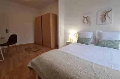 a bedroom with a bed and a desk and a chair at 21ARA1085- Fabulous 4BR apartment in Ciutat Vella in Barcelona