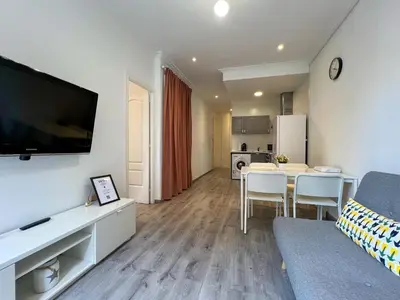 a living room with a kitchen and a dining room at Stay Unique Apartments Mallorca III in Barcelona